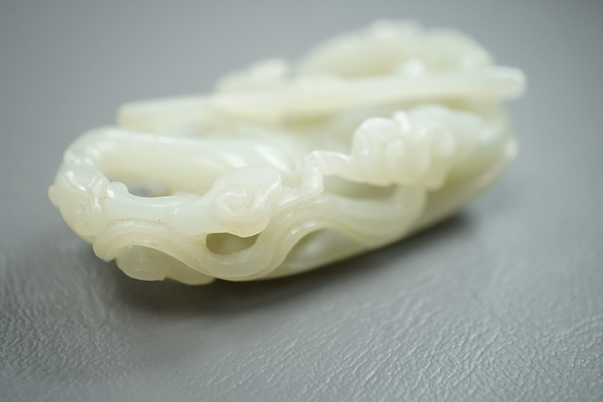 A Chinese pale celadon jade carving of Sun Wukong, the Monkey King, 18th/19th century